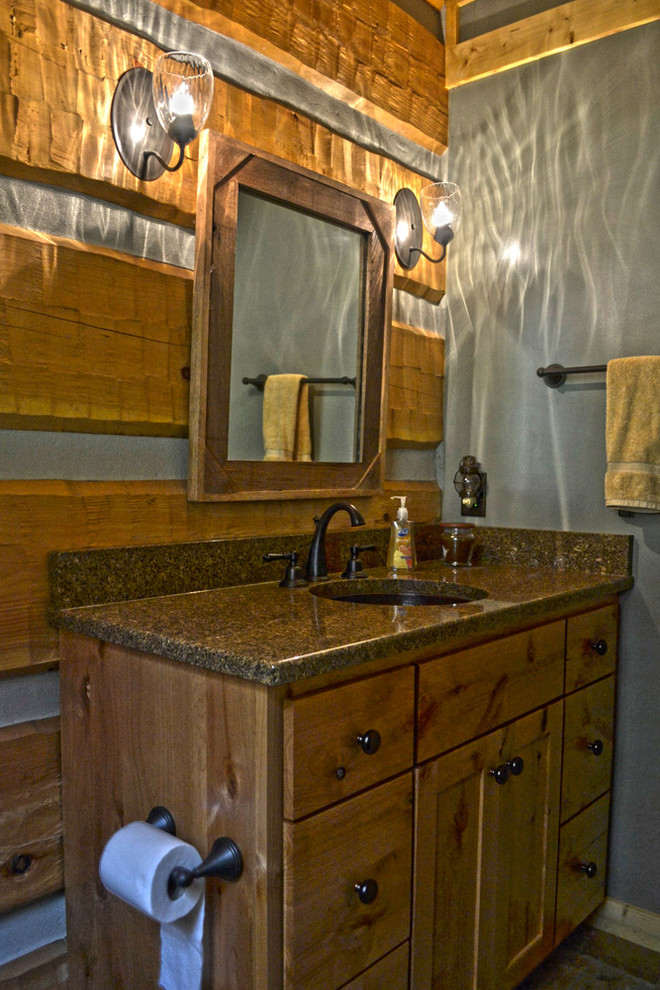 Design ideas for a medium sized rustic bathroom in Charlotte with a submerged sink, recessed-panel cabinets, medium wood cabinets, granite worktops, a built-in bath, a one-piece toilet, brown tiles, ceramic tiles, green walls and ceramic flooring.