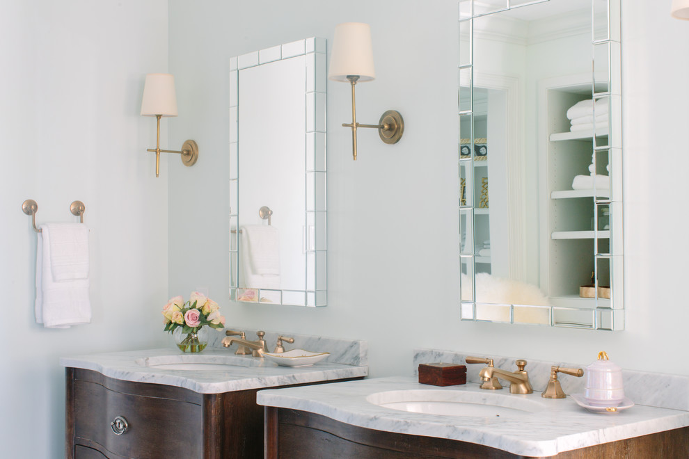 Example of a transitional gray tile and stone slab bathroom design in Other with an undermount sink, furniture-like cabinets, distressed cabinets, marble countertops and a two-piece toilet