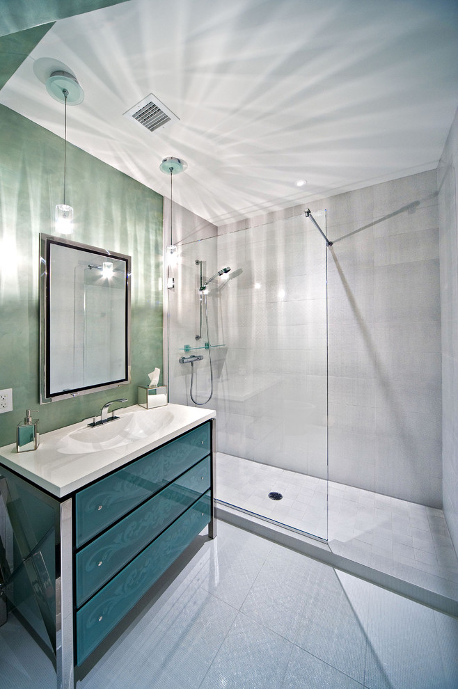 This is an example of a large contemporary shower room bathroom in New York with blue cabinets, engineered stone worktops, a walk-in shower, white tiles, porcelain tiles, porcelain flooring, an integrated sink, green walls and freestanding cabinets.
