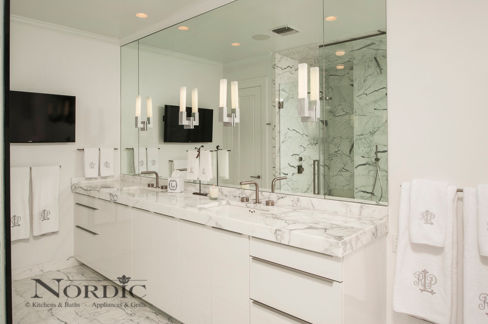 Photo of a large contemporary ensuite bathroom in New Orleans with a submerged sink, flat-panel cabinets, white cabinets, marble worktops, white walls, marble flooring, white tiles, stone tiles and a double shower.