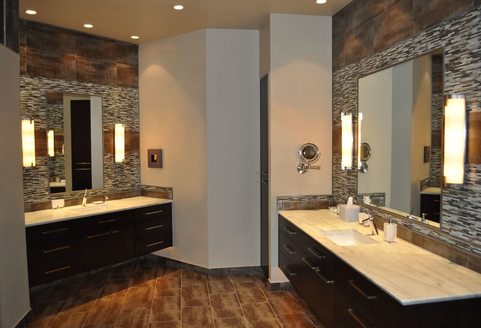 Large trendy master black and white tile, brown tile, multicolored tile and matchstick tile porcelain tile and brown floor bathroom photo in Phoenix with flat-panel cabinets, black cabinets, gray walls, an undermount sink and granite countertops