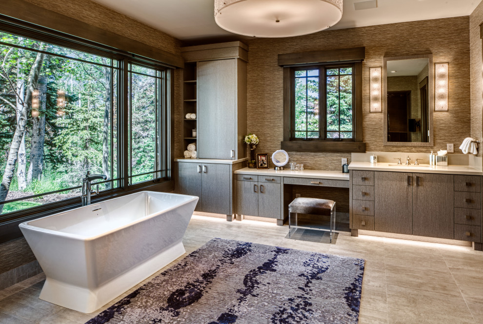 Inspiration for a contemporary gray floor, single-sink and wallpaper freestanding bathtub remodel in Salt Lake City with flat-panel cabinets, gray cabinets, brown walls, an undermount sink, white countertops and a built-in vanity