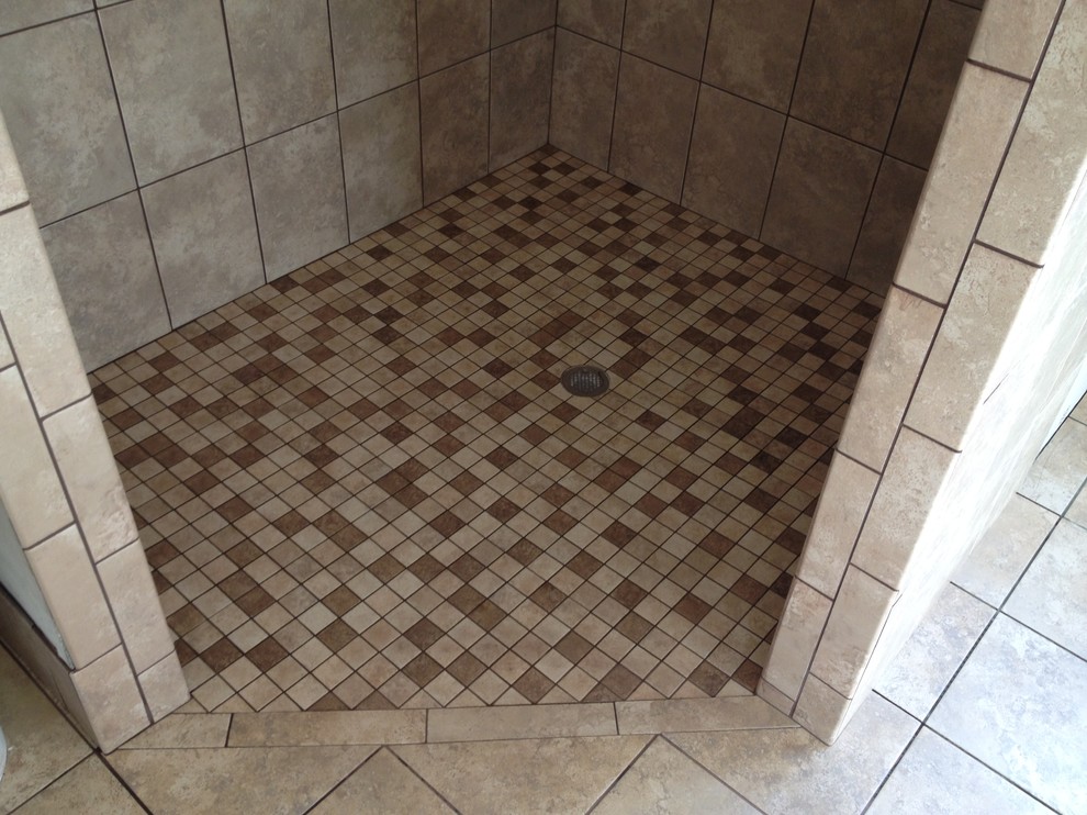 Photo of a traditional bathroom in Other with an alcove shower, beige tiles, brown tiles, ceramic tiles, beige walls and porcelain flooring.