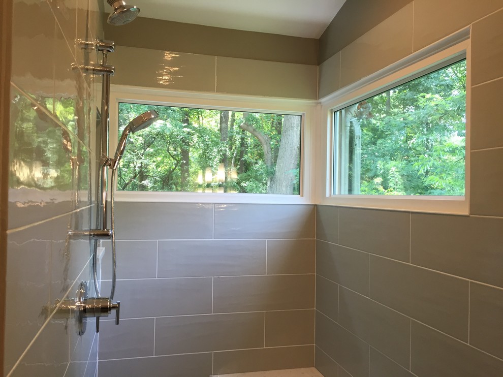 Photo of a large contemporary ensuite bathroom in Charlotte with flat-panel cabinets, dark wood cabinets, a walk-in shower, a two-piece toilet, green tiles, ceramic tiles, grey walls, porcelain flooring, a submerged sink and quartz worktops.