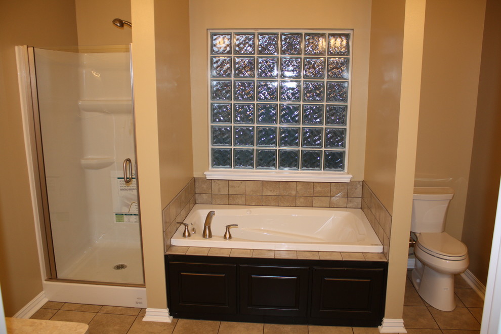 Mid-sized elegant master beige tile and ceramic tile ceramic tile bathroom photo in Other with raised-panel cabinets, black cabinets, a two-piece toilet and beige walls