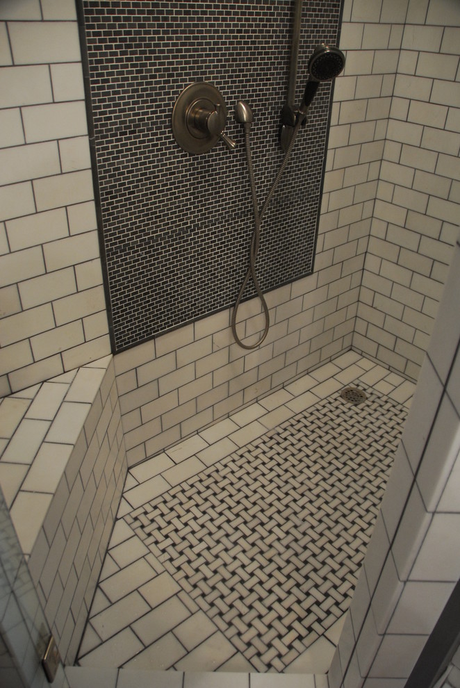 Large urban master white tile and subway tile dark wood floor and brown floor bathroom photo in Atlanta with raised-panel cabinets, distressed cabinets, a two-piece toilet, gray walls, an undermount sink and a hinged shower door