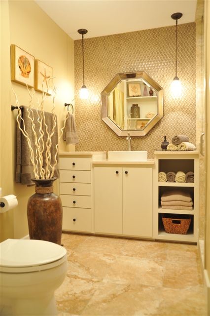 Inspiration for a medium sized contemporary shower room bathroom in Atlanta with freestanding cabinets, white cabinets, brown tiles, mosaic tiles, beige walls, travertine flooring, a vessel sink and beige floors.