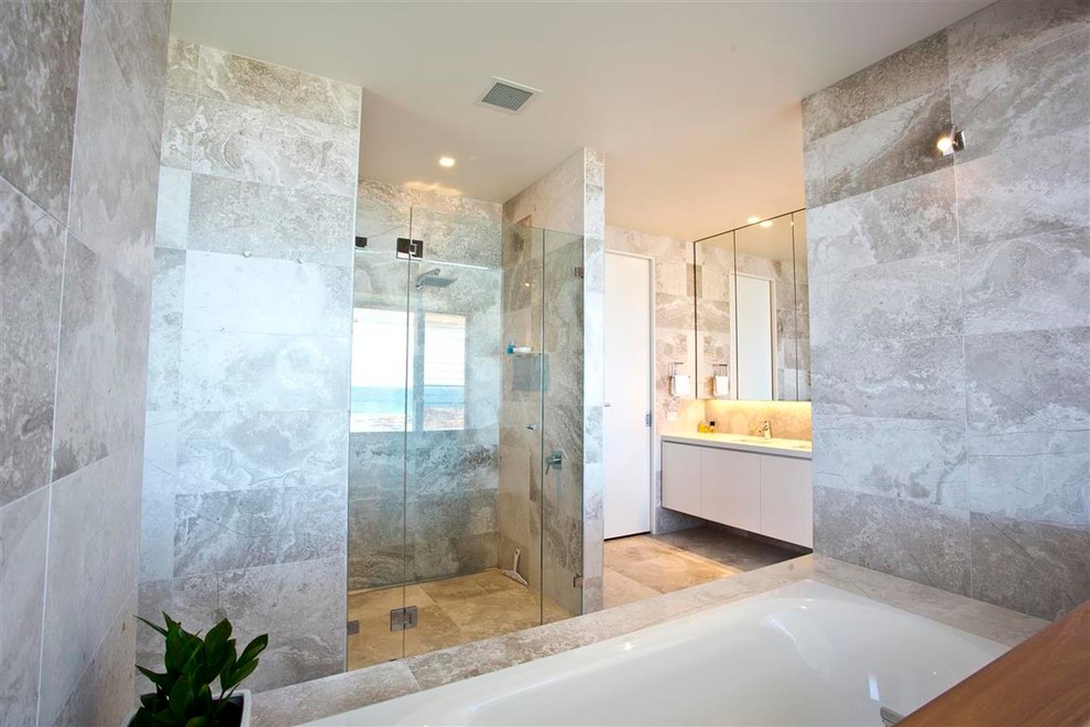 Medium sized contemporary ensuite bathroom in Central Coast with flat-panel cabinets, white cabinets, an alcove bath, an alcove shower, grey tiles, marble tiles, marble flooring, an integrated sink, granite worktops, grey floors and a hinged door.