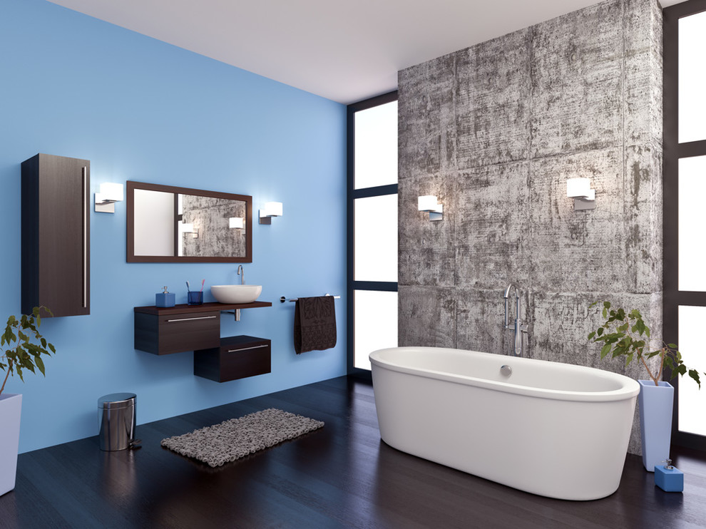 Idee per una grande stanza da bagno padronale minimalista con ante lisce, ante in legno bruno, vasca freestanding, pareti blu, pavimento in vinile, lavabo a bacinella, top in legno e pavimento blu