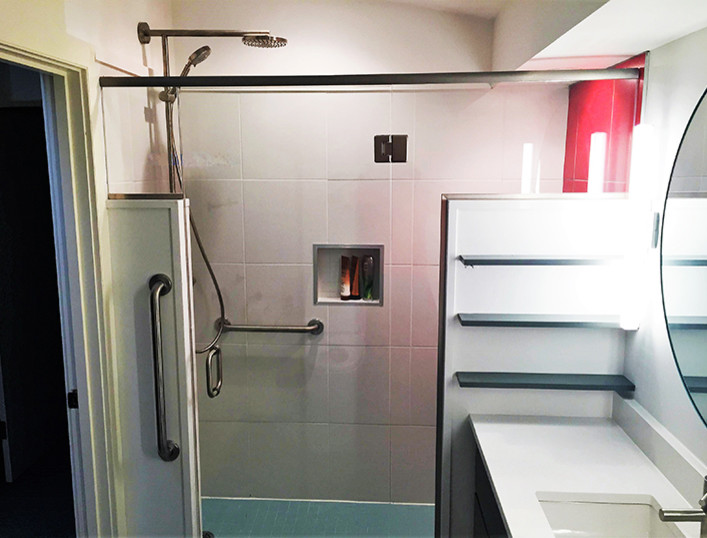 Example of a small trendy master red tile and ceramic tile ceramic tile walk-in shower design in Boston with flat-panel cabinets, dark wood cabinets, a bidet, white walls, an undermount sink and quartz countertops