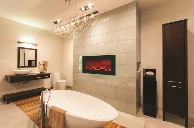Exemple d'une grande salle de bain principale tendance en bois foncé avec un placard à porte plane, une baignoire indépendante, un carrelage gris, un carrelage en pâte de verre, un mur beige, une vasque et un sol beige.