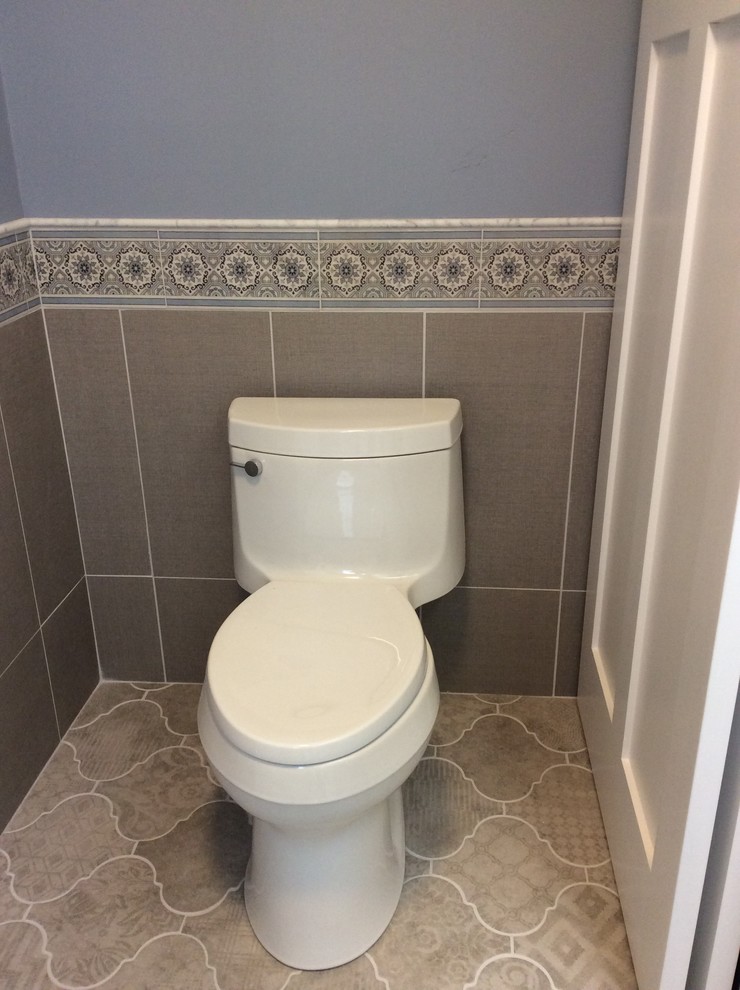 Immagine di una stanza da bagno chic con piastrelle in gres porcellanato e pavimento in gres porcellanato