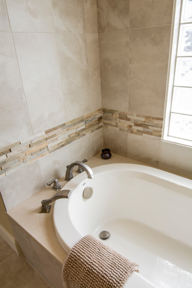 Inspiration for a mid-sized transitional master ceramic tile alcove shower remodel in Calgary with recessed-panel cabinets, medium tone wood cabinets, a two-piece toilet, beige walls, an undermount sink and soapstone countertops