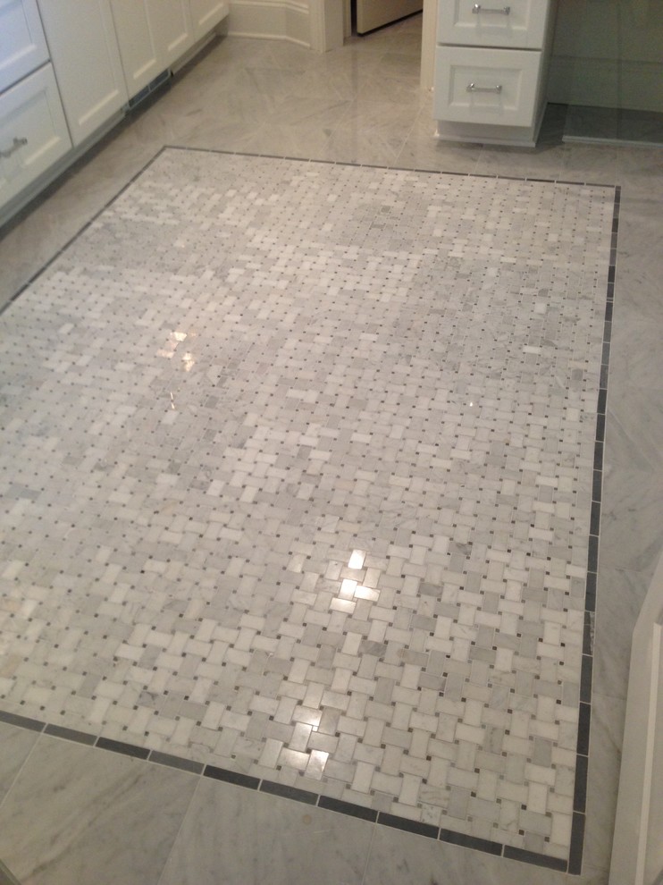 Elegant stone tile marble floor bathroom photo in New Orleans