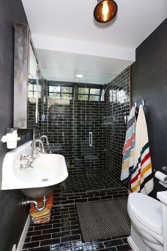 Inspiration for a small contemporary 3/4 black tile bathroom remodel in Orange County with a trough sink, black walls and a hinged shower door