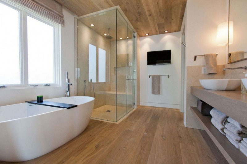Photo of a medium sized modern ensuite bathroom in Orange County with open cabinets, beige cabinets, a freestanding bath, a corner shower, beige tiles, porcelain tiles, white walls, light hardwood flooring, a vessel sink, engineered stone worktops, beige floors and a hinged door.