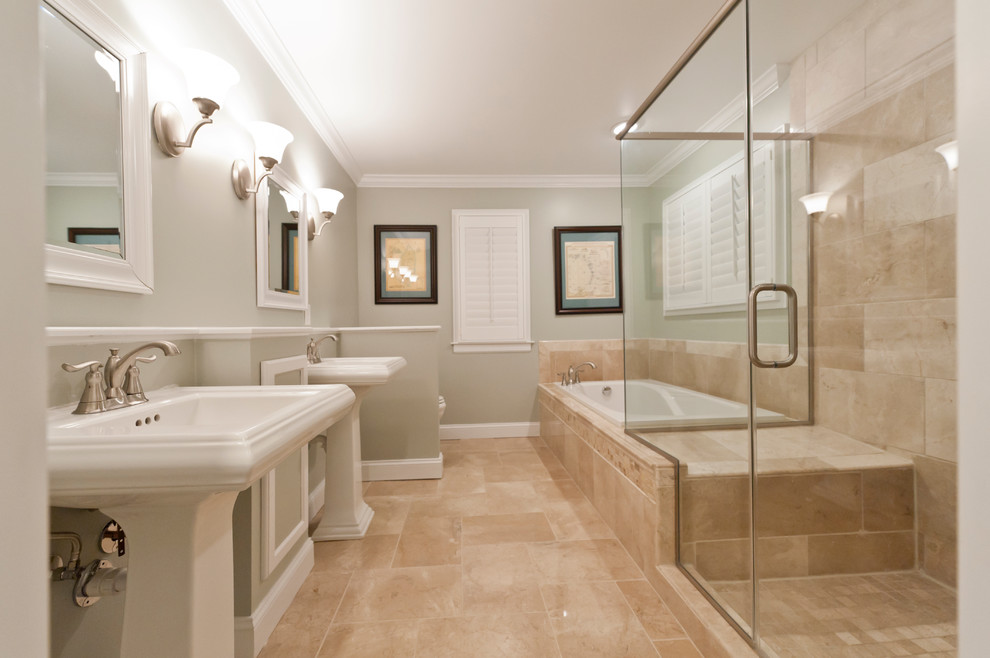 This is an example of a classic bathroom in Richmond with a built-in bath, a built-in shower, a two-piece toilet, brown tiles, porcelain tiles, green walls, porcelain flooring, a pedestal sink, brown floors and a hinged door.