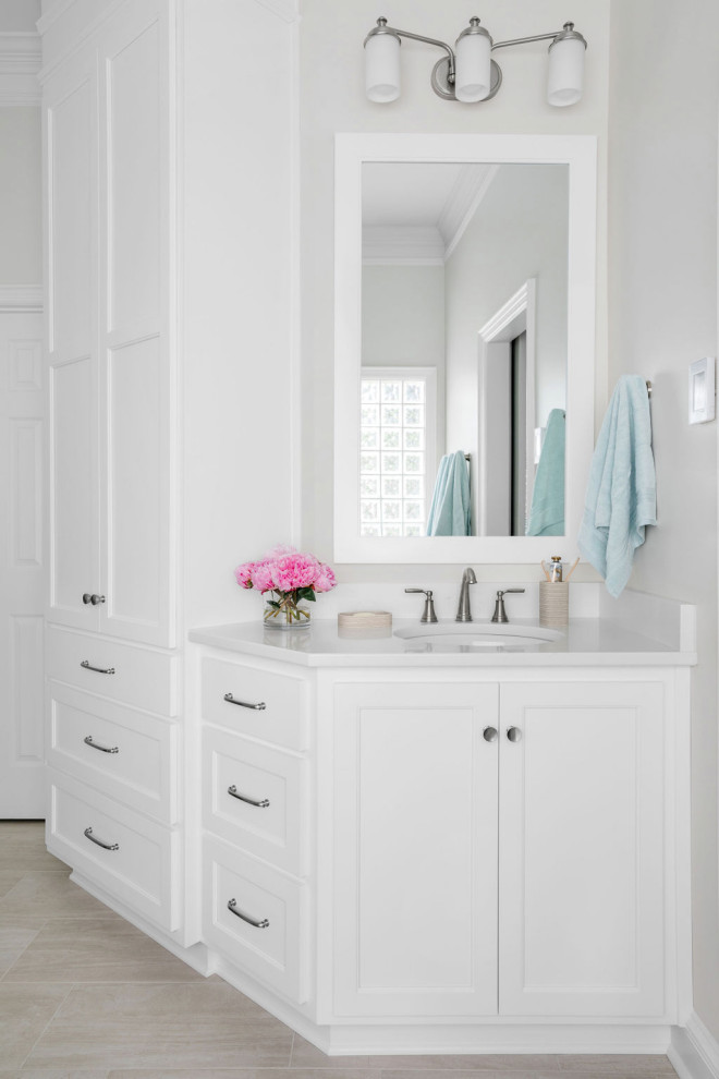 Design ideas for a large traditional ensuite bathroom in Atlanta with recessed-panel cabinets, white cabinets, grey walls, porcelain flooring, a submerged sink, engineered stone worktops, grey floors and white worktops.