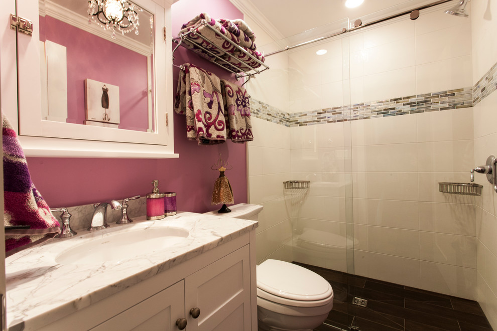 Bathroom - mid-sized eclectic kids' multicolored tile and ceramic tile ceramic tile bathroom idea in DC Metro with an undermount sink, raised-panel cabinets, white cabinets, marble countertops, a two-piece toilet and pink walls