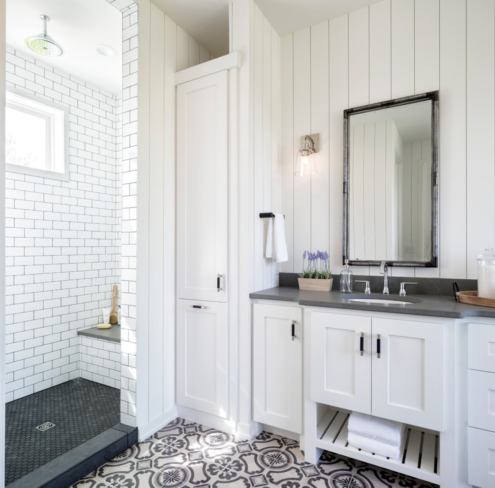 Inspiration for a country white tile and subway tile multicolored floor bathroom remodel in Minneapolis with shaker cabinets, white cabinets, white walls, an undermount sink and gray countertops