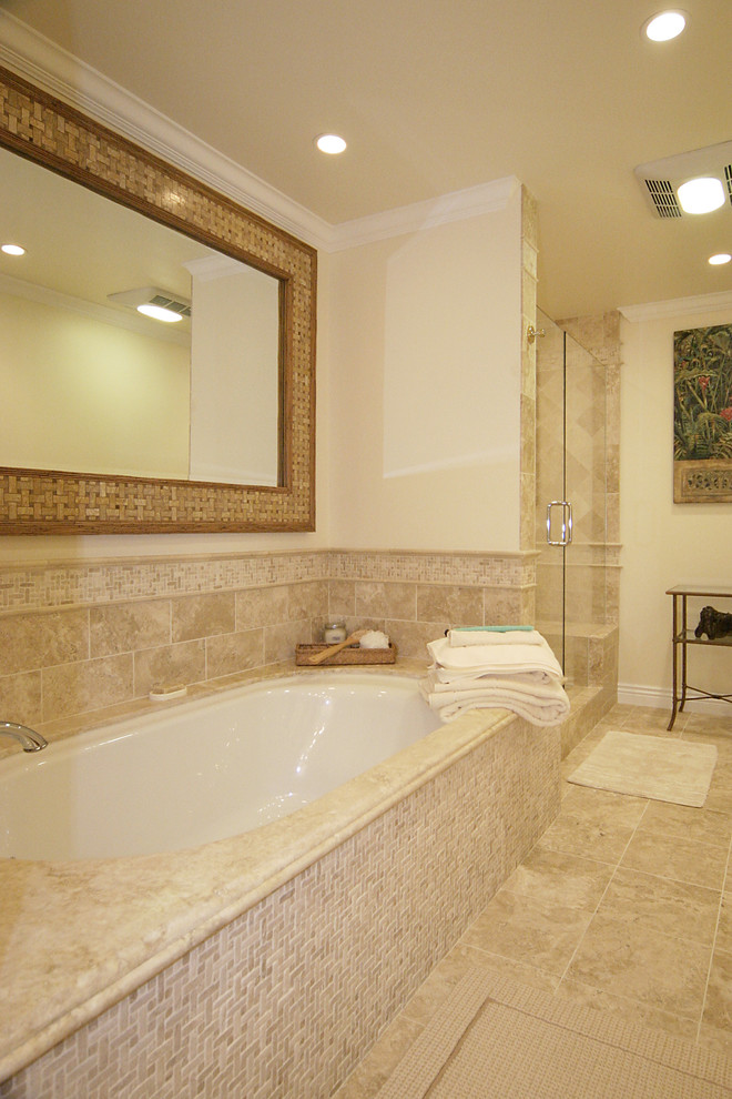Photo of a medium sized traditional ensuite bathroom in Santa Barbara with a submerged bath, a corner shower, beige tiles, ceramic tiles, beige walls, travertine flooring, beige floors and a hinged door.