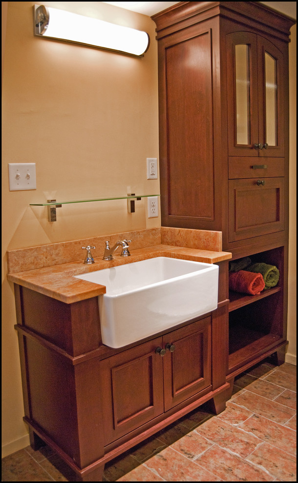 Photo of a bohemian ensuite bathroom in Minneapolis with recessed-panel cabinets, medium wood cabinets, marble worktops, a built-in bath, a shower/bath combination, ceramic tiles and ceramic flooring.