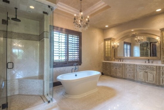 Inspiration for an expansive classic ensuite bathroom in Phoenix with flat-panel cabinets, medium wood cabinets, a built-in bath, a built-in shower, a one-piece toilet, white tiles, porcelain tiles, beige walls, porcelain flooring, a built-in sink and granite worktops.