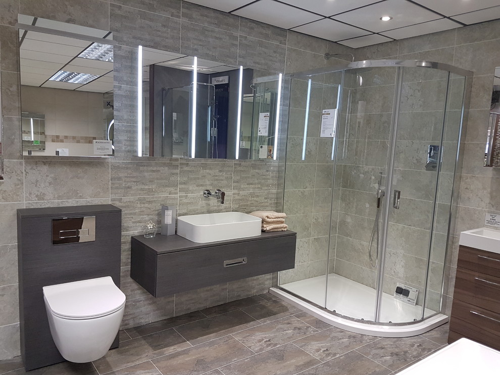 Large contemporary bathroom in Manchester with dark wood cabinets, a corner shower, a wall mounted toilet and a vessel sink.