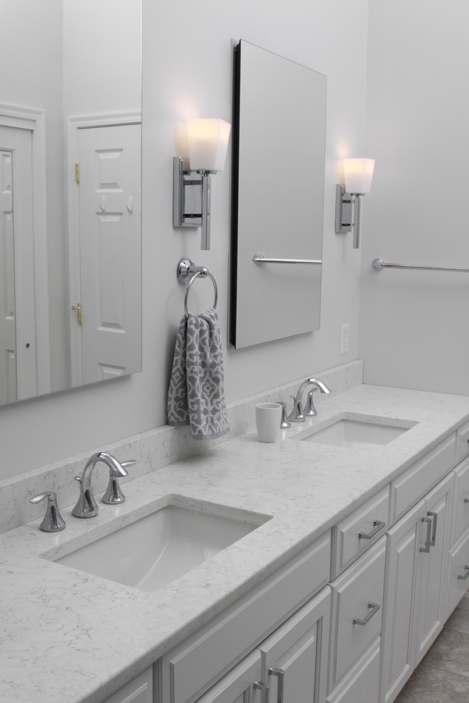 Example of a large transitional master porcelain tile and gray floor bathroom design in Cincinnati with raised-panel cabinets, white cabinets, a two-piece toilet, gray walls and an undermount sink