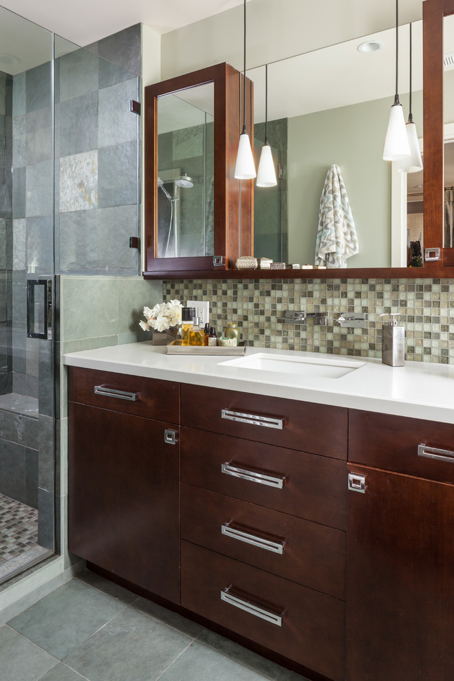This is an example of a medium sized contemporary ensuite bathroom in San Francisco with a submerged sink, flat-panel cabinets, medium wood cabinets, engineered stone worktops, an alcove shower, a one-piece toilet, yellow tiles, glass tiles, green walls and slate flooring.