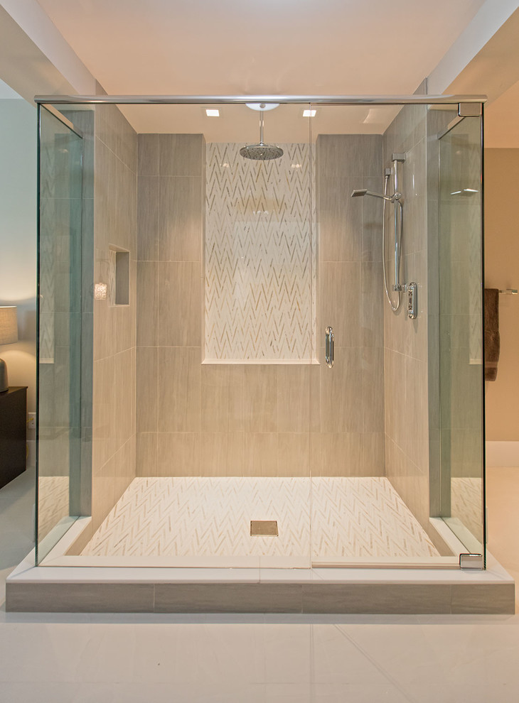 Inspiration for a large modern ensuite bathroom in Miami with shaker cabinets, grey cabinets, a double shower, a one-piece toilet, white tiles, porcelain tiles, beige walls, porcelain flooring, an integrated sink and granite worktops.