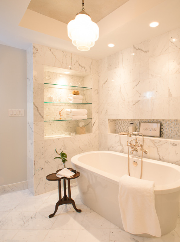 Example of a large transitional master white tile and marble tile marble floor and gray floor freestanding bathtub design in Houston with gray walls