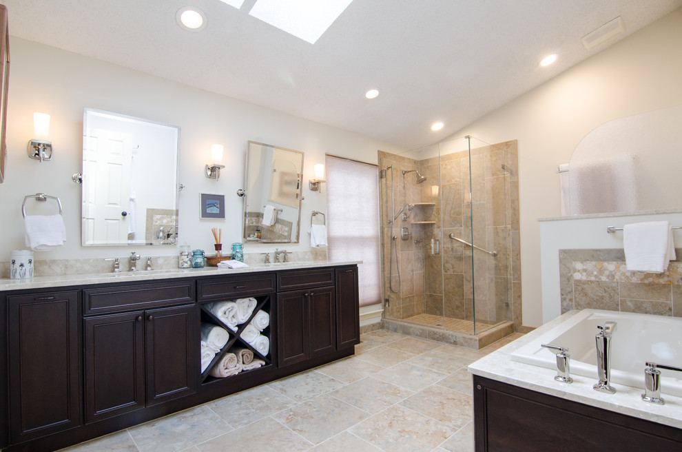 Inspiration for a mid-sized eclectic multicolored tile and porcelain tile porcelain tile bathroom remodel in DC Metro with an undermount sink, recessed-panel cabinets, dark wood cabinets, quartz countertops, a two-piece toilet and white walls