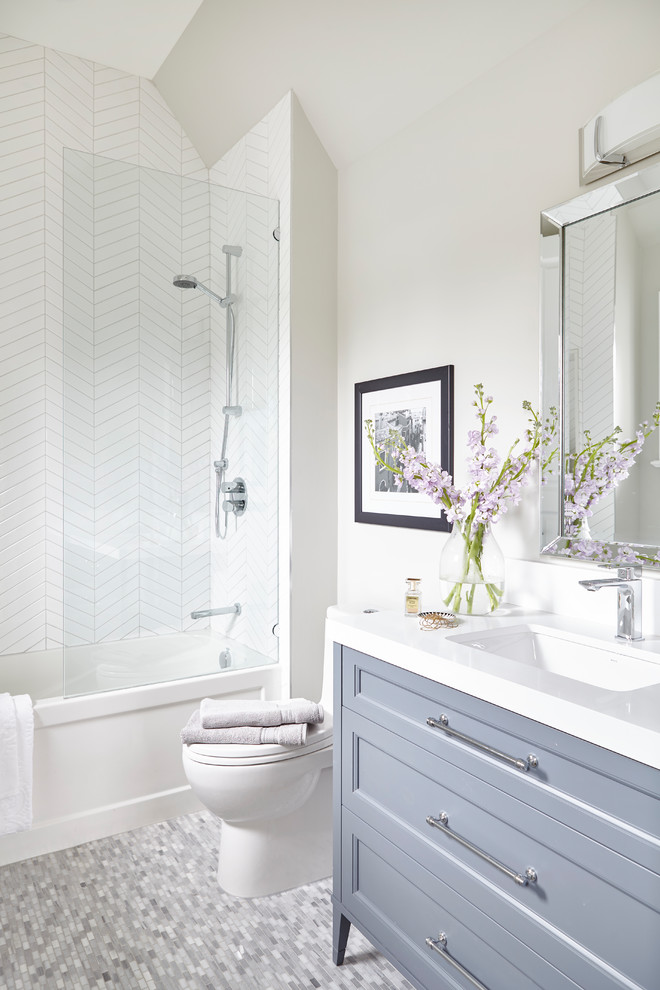 Bathroom - small contemporary kids' white tile and ceramic tile mosaic tile floor and multicolored floor bathroom idea in Toronto with furniture-like cabinets, gray cabinets, a two-piece toilet, white walls, an undermount sink, quartzite countertops and white countertops