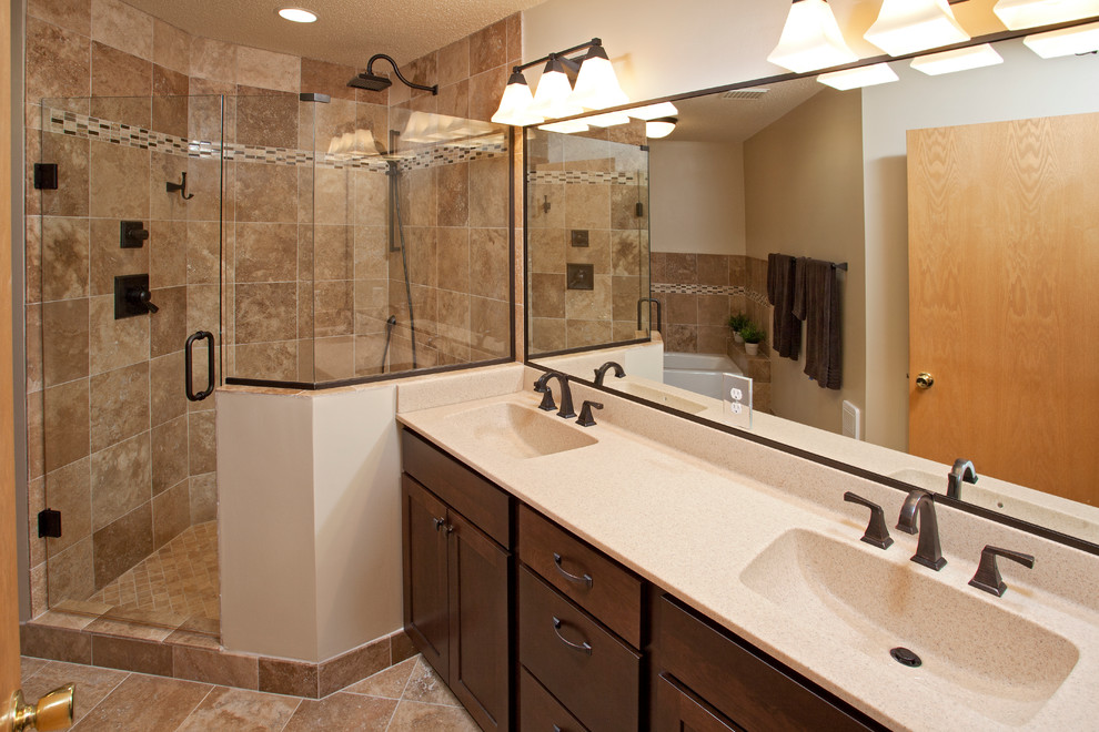 Example of a mid-sized transitional master beige tile and stone tile travertine floor corner shower design in Minneapolis with an integrated sink, shaker cabinets, dark wood cabinets, a two-piece toilet and white walls