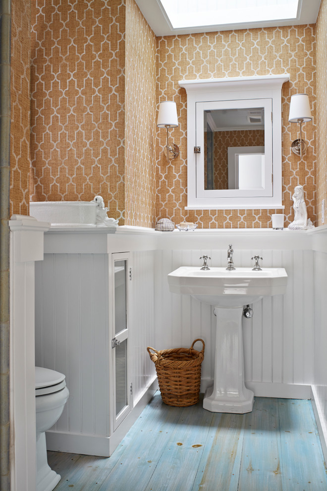 Inspiration for a beach style bathroom in New York with a pedestal sink, an alcove shower, a two-piece toilet, orange walls, painted wood flooring and turquoise floors.