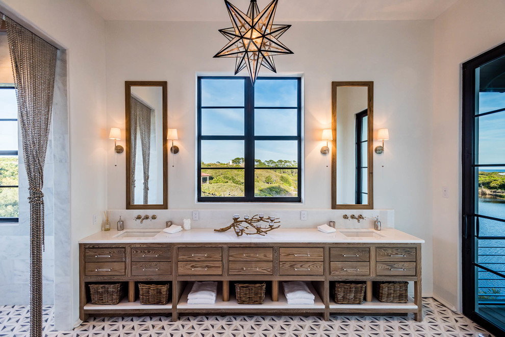Example of a tuscan multicolored floor and cement tile floor doorless shower design in Miami with furniture-like cabinets, dark wood cabinets, white walls, an undermount sink, solid surface countertops and white countertops