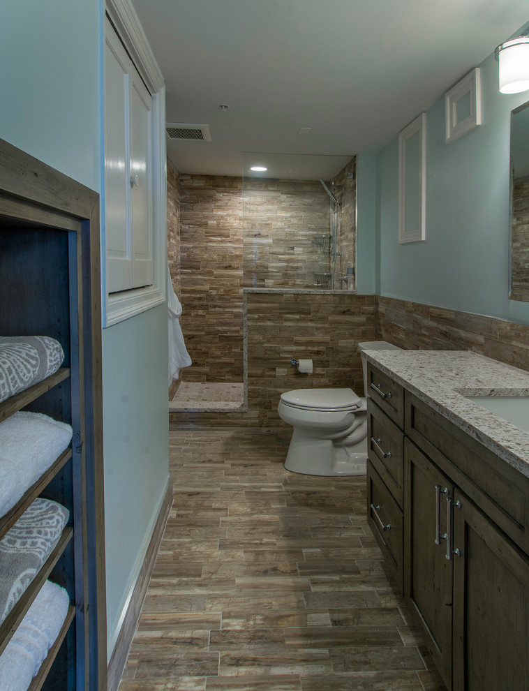 Inspiration for a large transitional kids' multicolored tile and porcelain tile porcelain tile doorless shower remodel in Tampa with shaker cabinets, gray cabinets, a two-piece toilet, green walls, an undermount sink and quartz countertops
