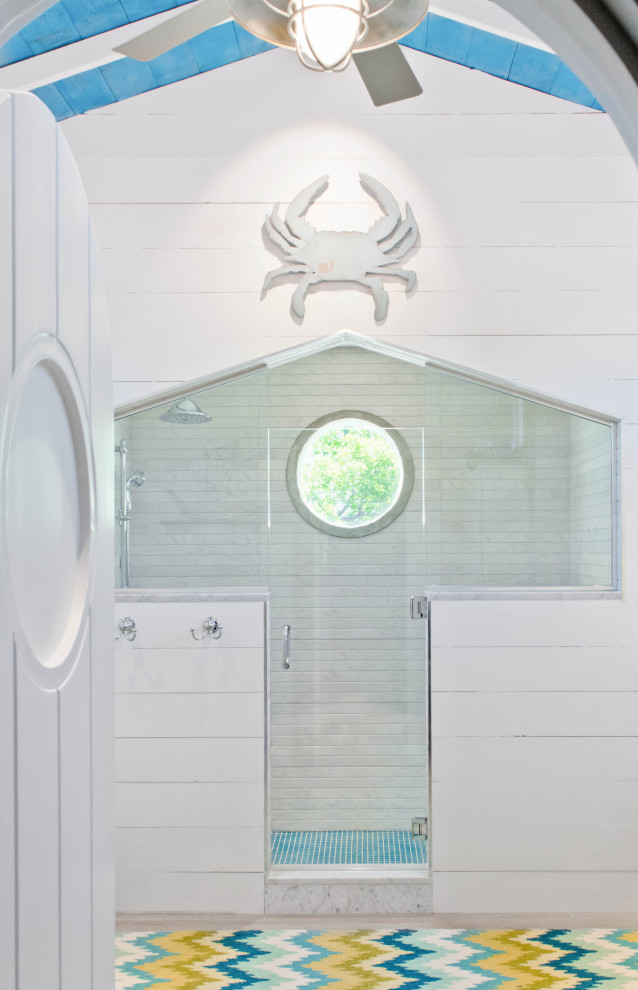 Example of a mid-sized beach style kids' multicolored tile double-sink alcove shower design in Austin with shaker cabinets, white cabinets, marble countertops, a hinged shower door, white countertops and a freestanding vanity
