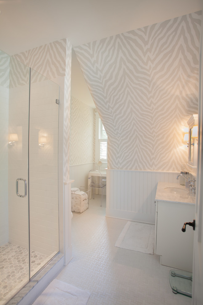 Inspiration for a coastal white tile and subway tile alcove shower remodel in Philadelphia with an undermount sink, white cabinets and multicolored walls