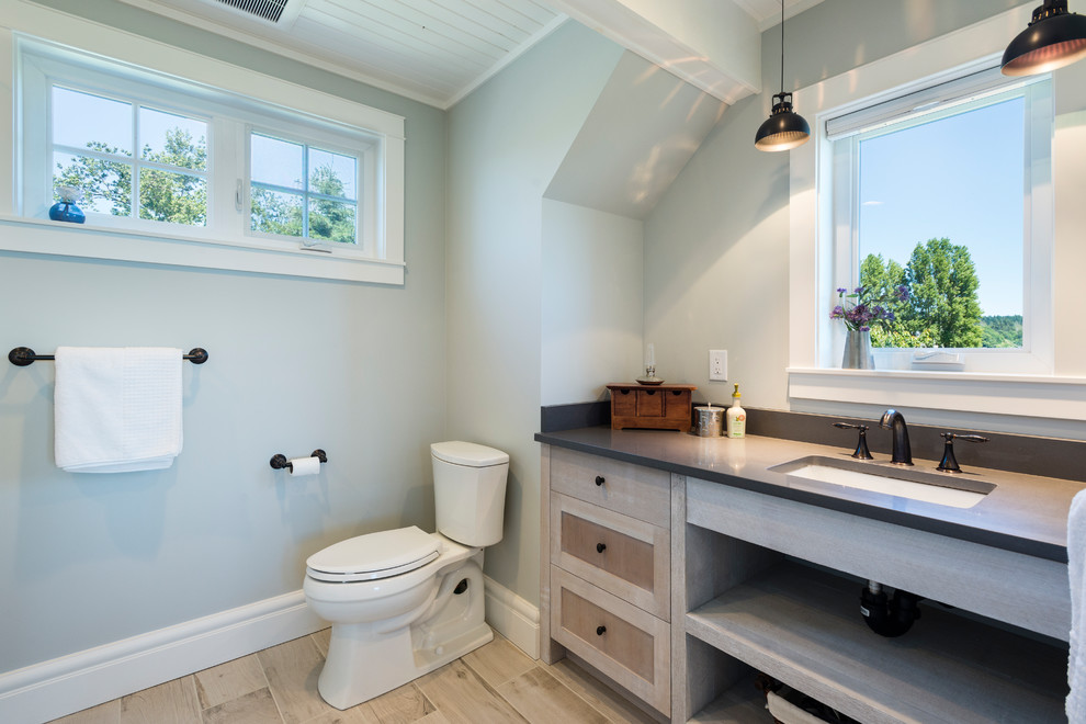 Inspiration for a small coastal shower room bathroom in Seattle with an alcove shower, a two-piece toilet, grey walls, a hinged door, porcelain flooring, a submerged sink and beige floors.