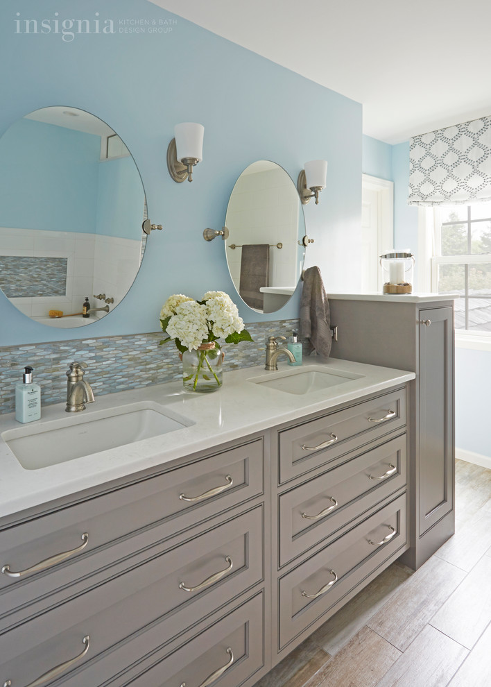 Mid-sized beach style master porcelain tile bathroom photo in Chicago with an undermount sink, beaded inset cabinets, quartz countertops and blue walls