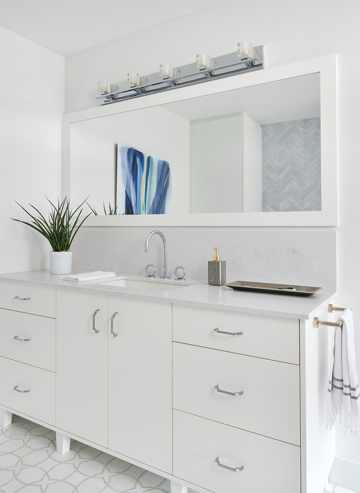 Bathroom - large modern master blue tile and marble tile marble floor and white floor bathroom idea in Toronto with flat-panel cabinets, white cabinets, an undermount tub, a one-piece toilet, white walls, an undermount sink, quartz countertops and white countertops