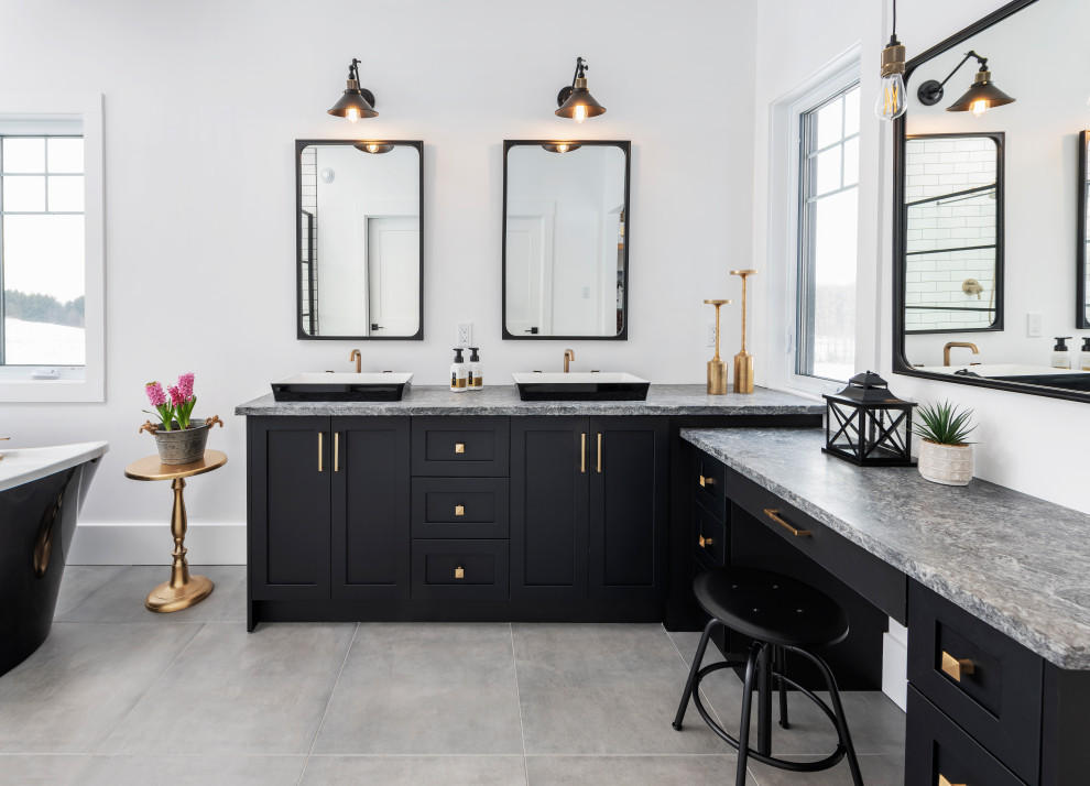 Example of a transitional master gray floor and double-sink freestanding bathtub design in Ottawa with shaker cabinets, black cabinets, white walls, a vessel sink, gray countertops and a built-in vanity