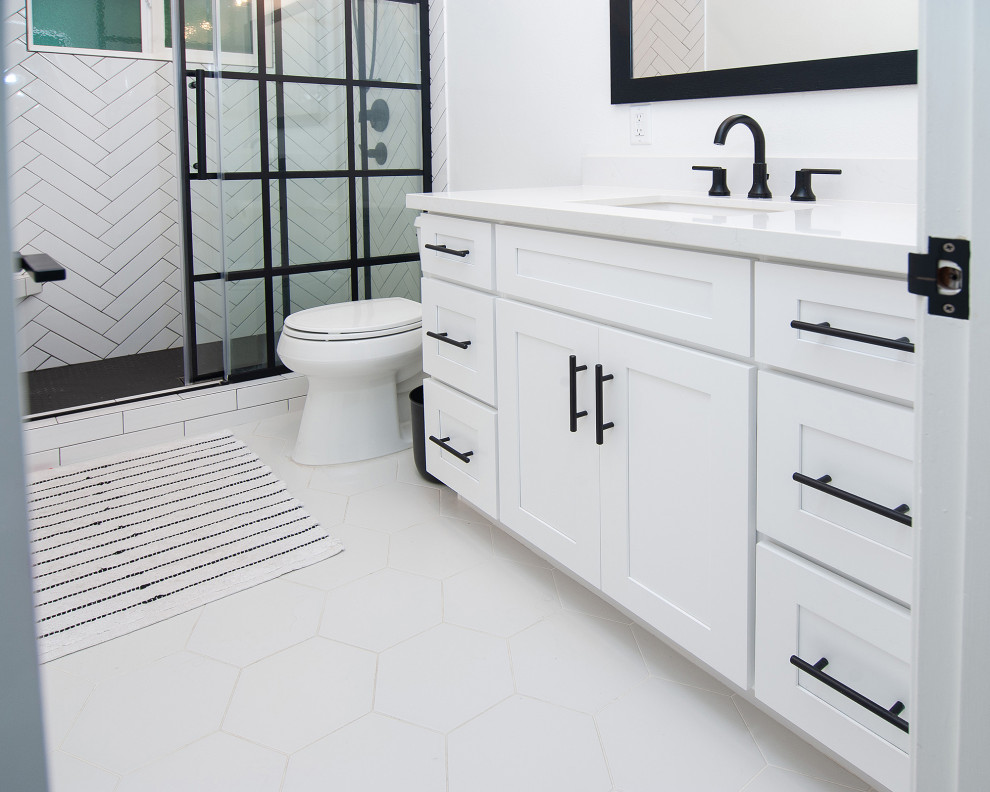 Mid-sized urban 3/4 white tile and subway tile porcelain tile and white floor bathroom photo in San Diego with shaker cabinets, white cabinets, a two-piece toilet, white walls, an undermount sink and white countertops