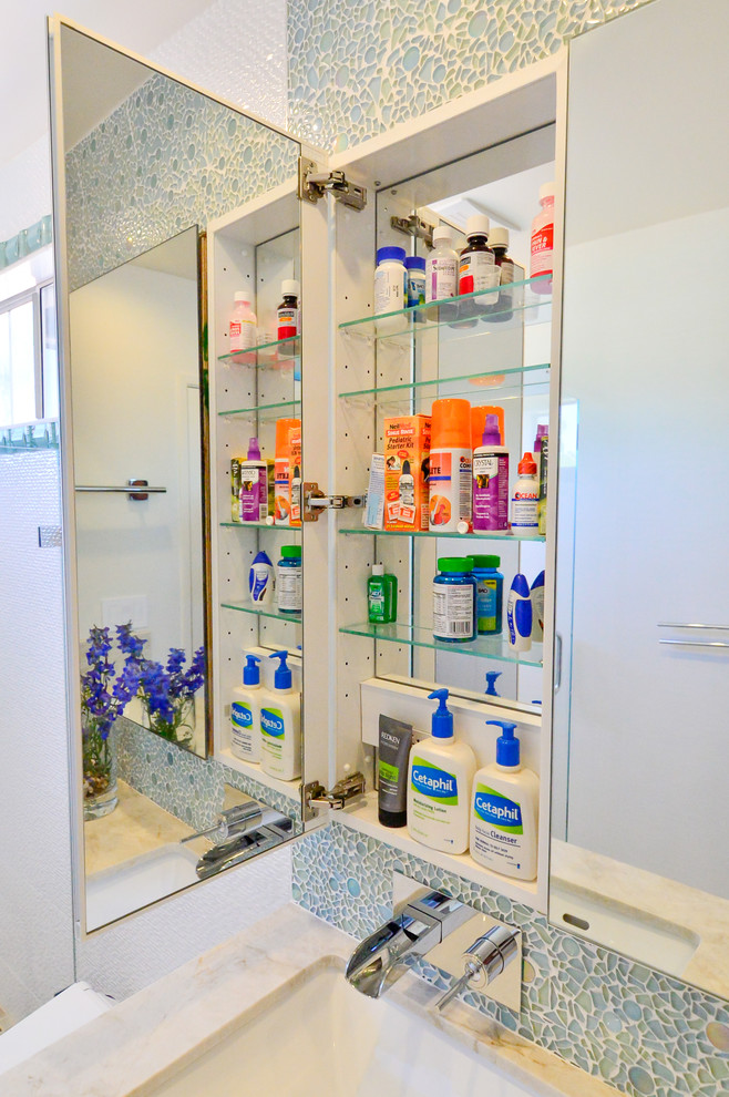 Example of a mid-sized trendy kids' green tile and glass tile porcelain tile doorless shower design in Tampa with an undermount sink, flat-panel cabinets, white cabinets, granite countertops, a bidet and white walls