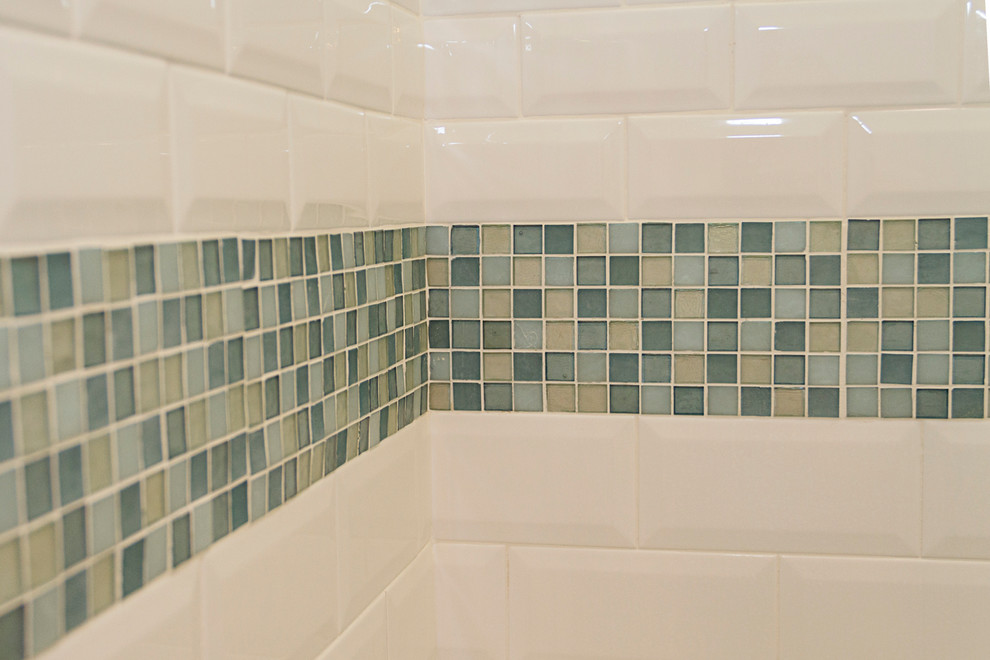 Design ideas for a small coastal shower room bathroom in Phoenix with shaker cabinets, white cabinets, an alcove shower, a one-piece toilet, blue tiles, metro tiles, blue walls, terracotta flooring, a submerged sink and laminate worktops.
