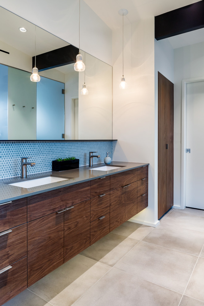 This is an example of a medium sized modern ensuite bathroom in Seattle with a submerged sink, flat-panel cabinets, dark wood cabinets, engineered stone worktops, a built-in shower, grey tiles, ceramic tiles, white walls and porcelain flooring.