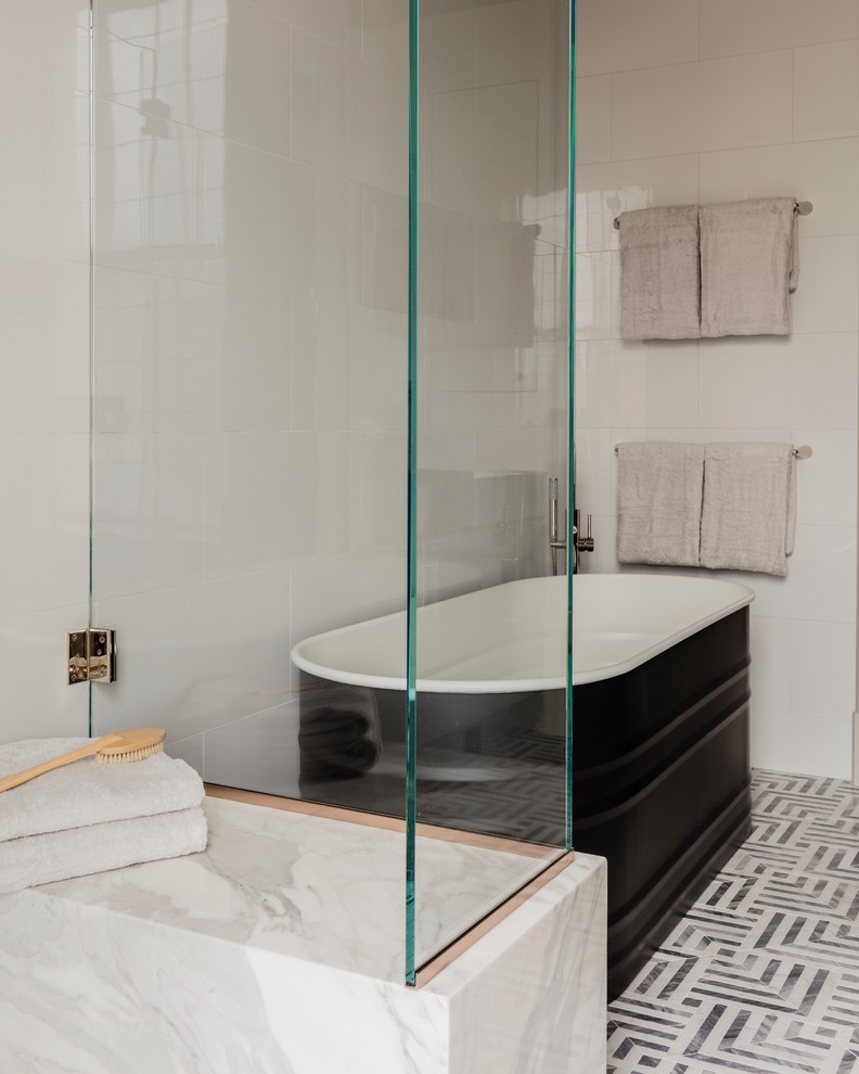 Example of a mid-sized transitional master white tile and porcelain tile marble floor bathroom design in Boston with flat-panel cabinets, gray cabinets, a one-piece toilet, gray walls, an undermount sink and marble countertops