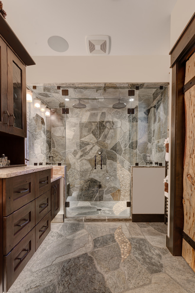 Inspiration for a rustic master beige tile and travertine tile slate floor, gray floor and double-sink bathroom remodel in Other with shaker cabinets, medium tone wood cabinets, a one-piece toilet, white walls, a vessel sink, quartzite countertops, a hinged shower door, beige countertops and a floating vanity